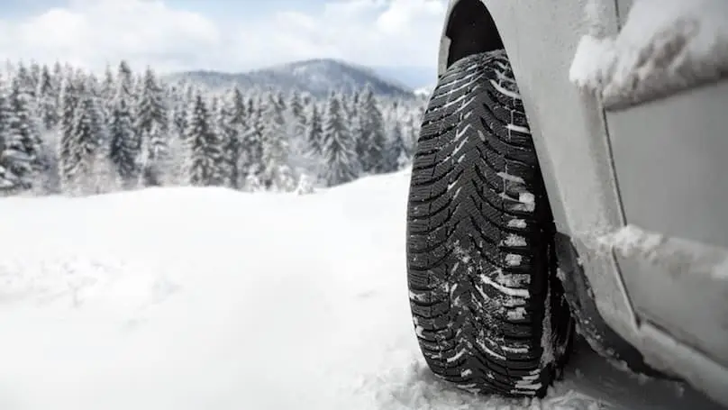 winter tires on car in snow